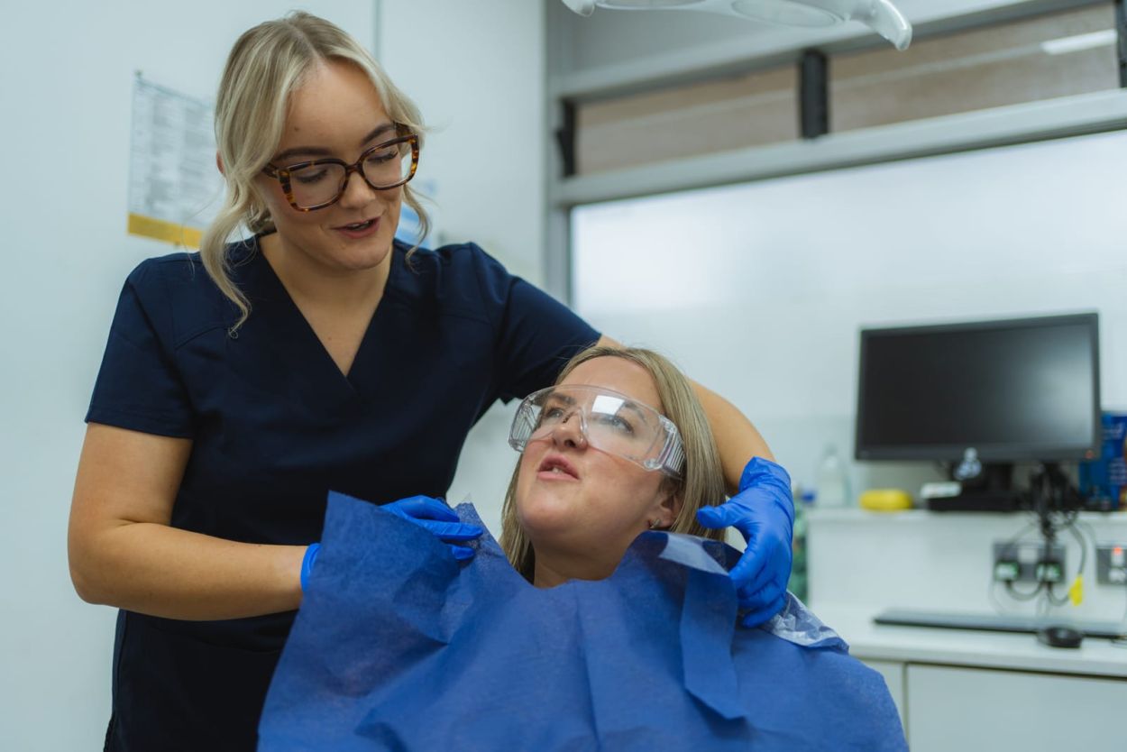 Dentist examining a patient with toothache at Whiteley Dental Practice